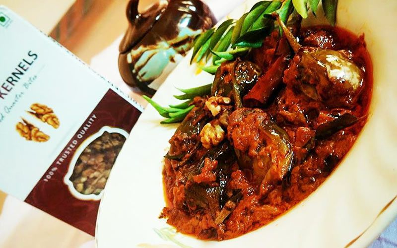 Brinjal khatta with walnuts